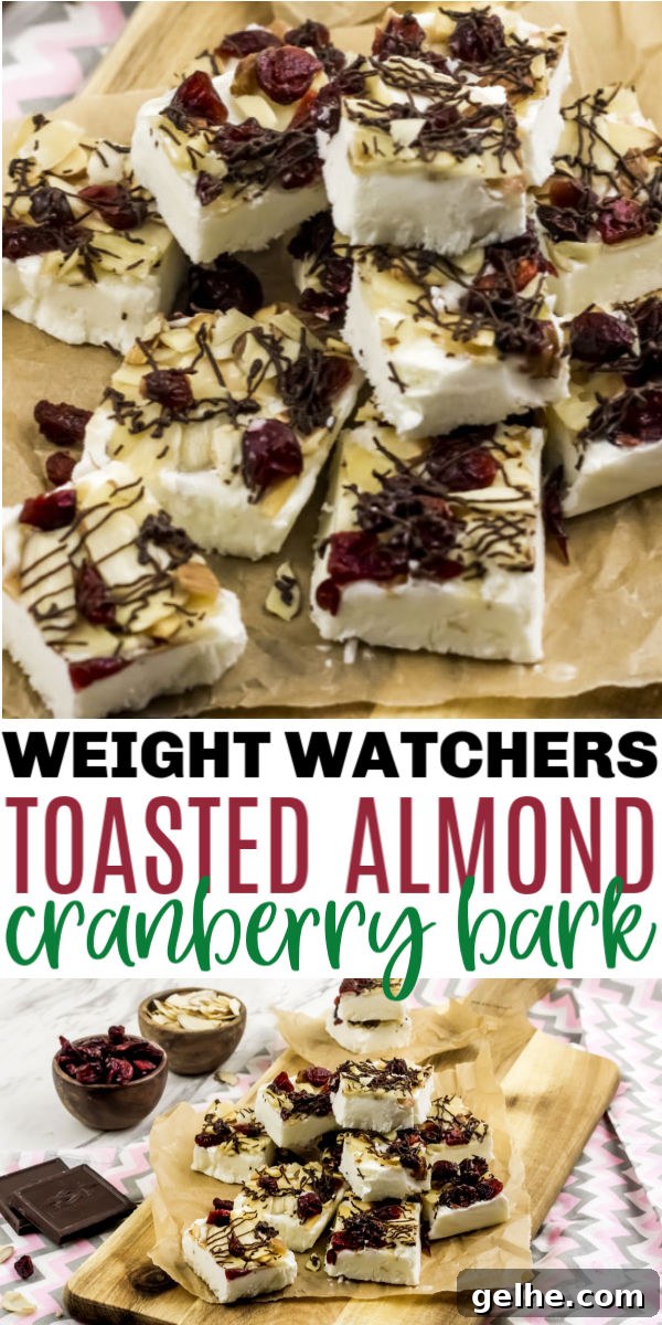 Toasted Almond Cranberry Bark Recipe with Step-by-Step Photos 9 WW Yogurt Bark finished and stacked on a sheet of parchment paper on top of a wooden cutting board.