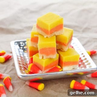 Candy Corn Fudge on silver platter, with candy corn sprinkled around the table