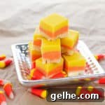 Candy Corn Fudge on silver platter, with candy corn sprinkled around the table