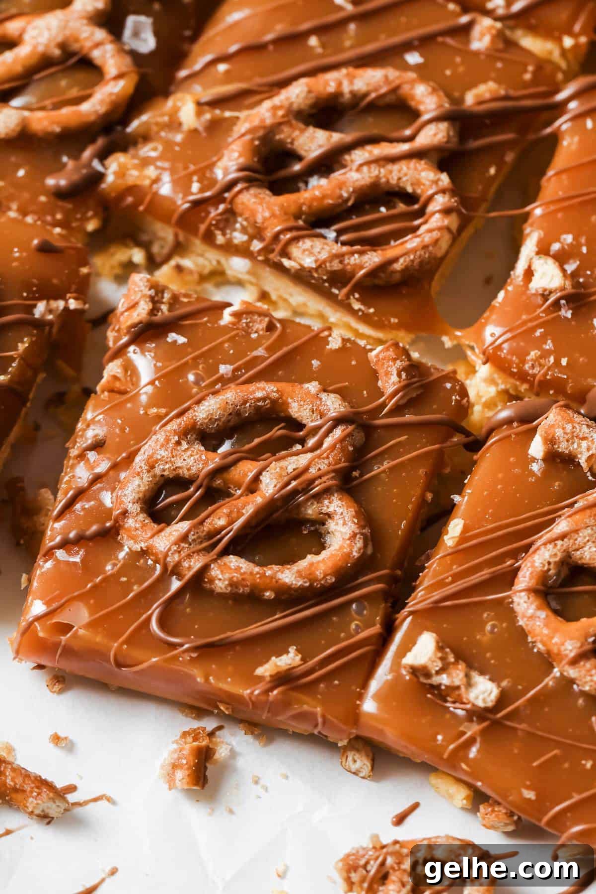 Caramel Cookie Bars on a counter with a drizzle of chocolate. Overhead shot.