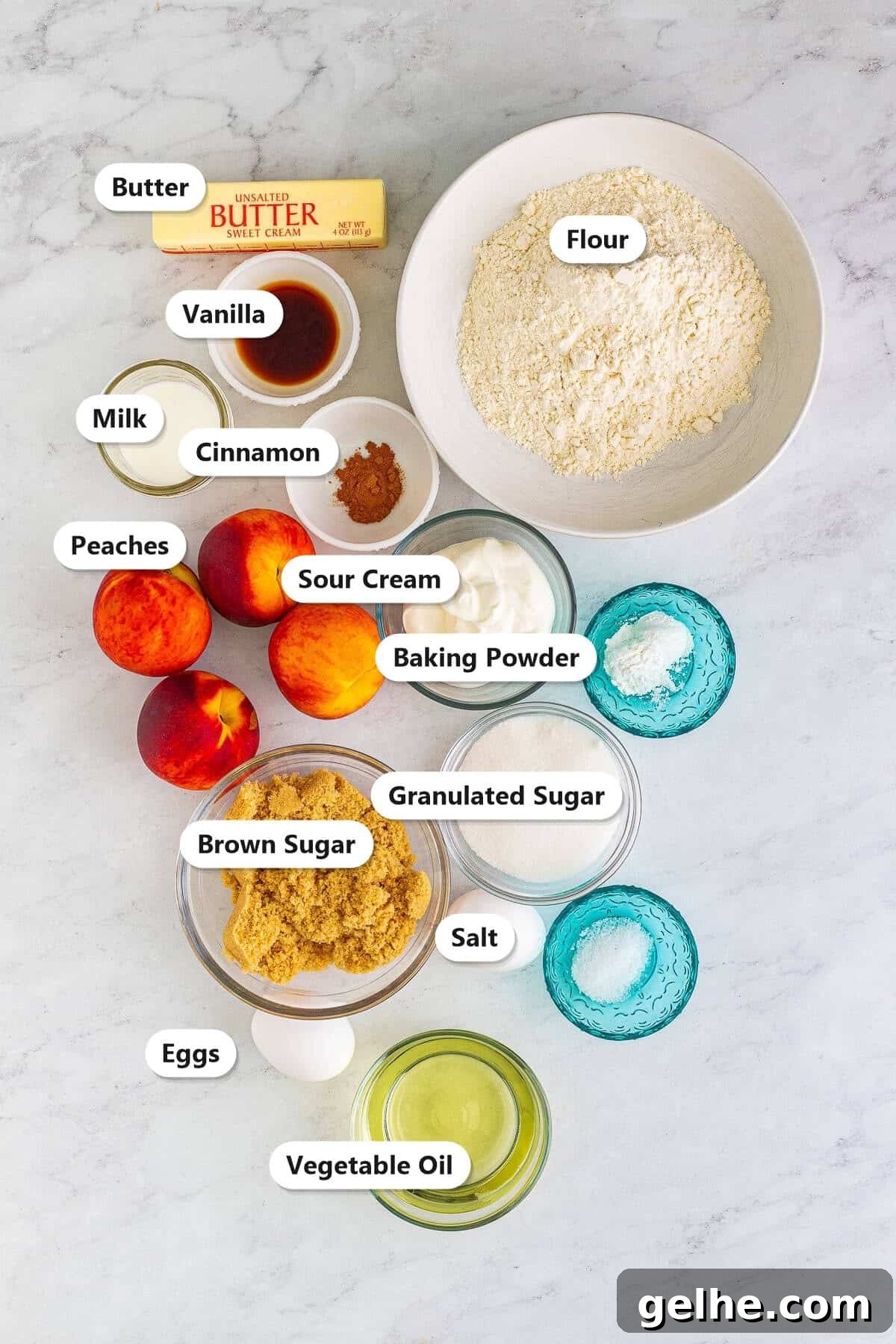 Peach muffin ingredients labeled including butter, flour, vanilla, milk, cinnamon, peaches, sour cream, baking powder, brown sugar, granulated sugar, salt, eggs, and vegetable oil.