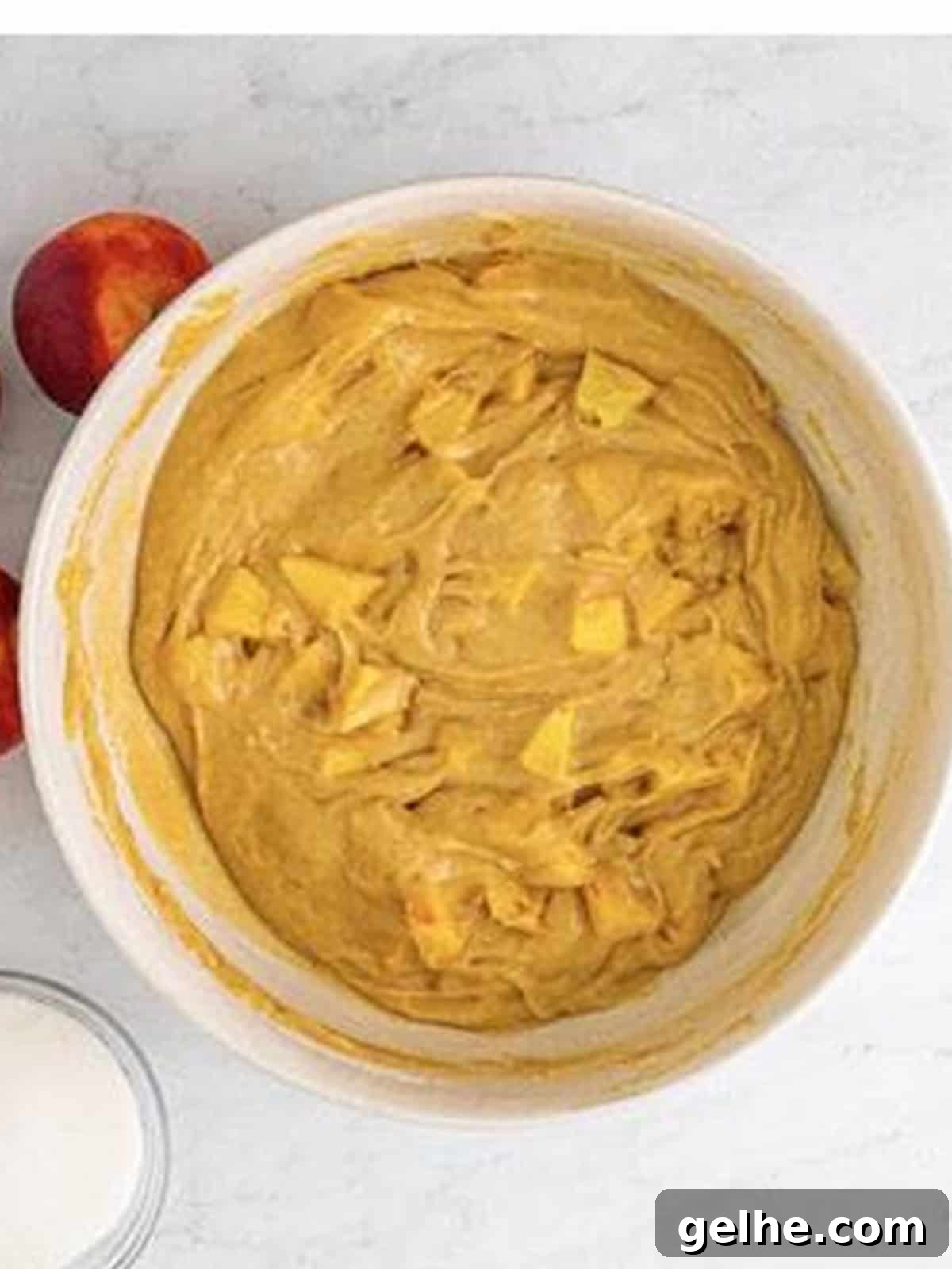 Chopped fresh peaches folded into the muffin batter.