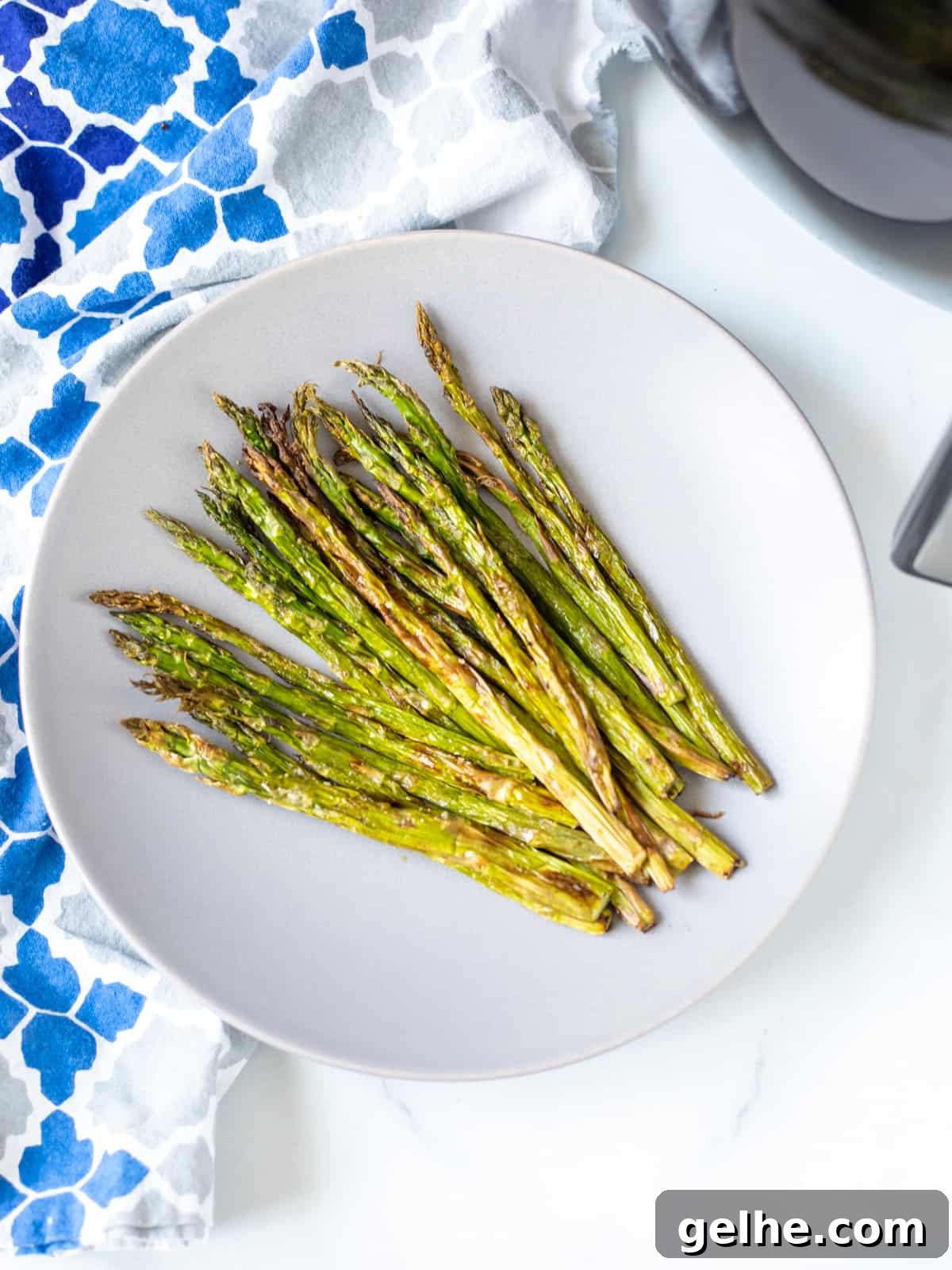 A plate of air fryer crispy asparagus.