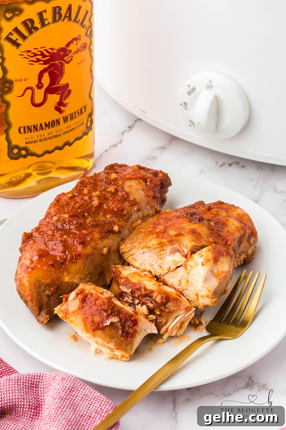 Crock Pot Fireball Chicken - a flavorful slow cooker chicken seasoned with a homemade Fireball-flavored sauce! The whiskey sauce makes the chicken so juicy and delicious.