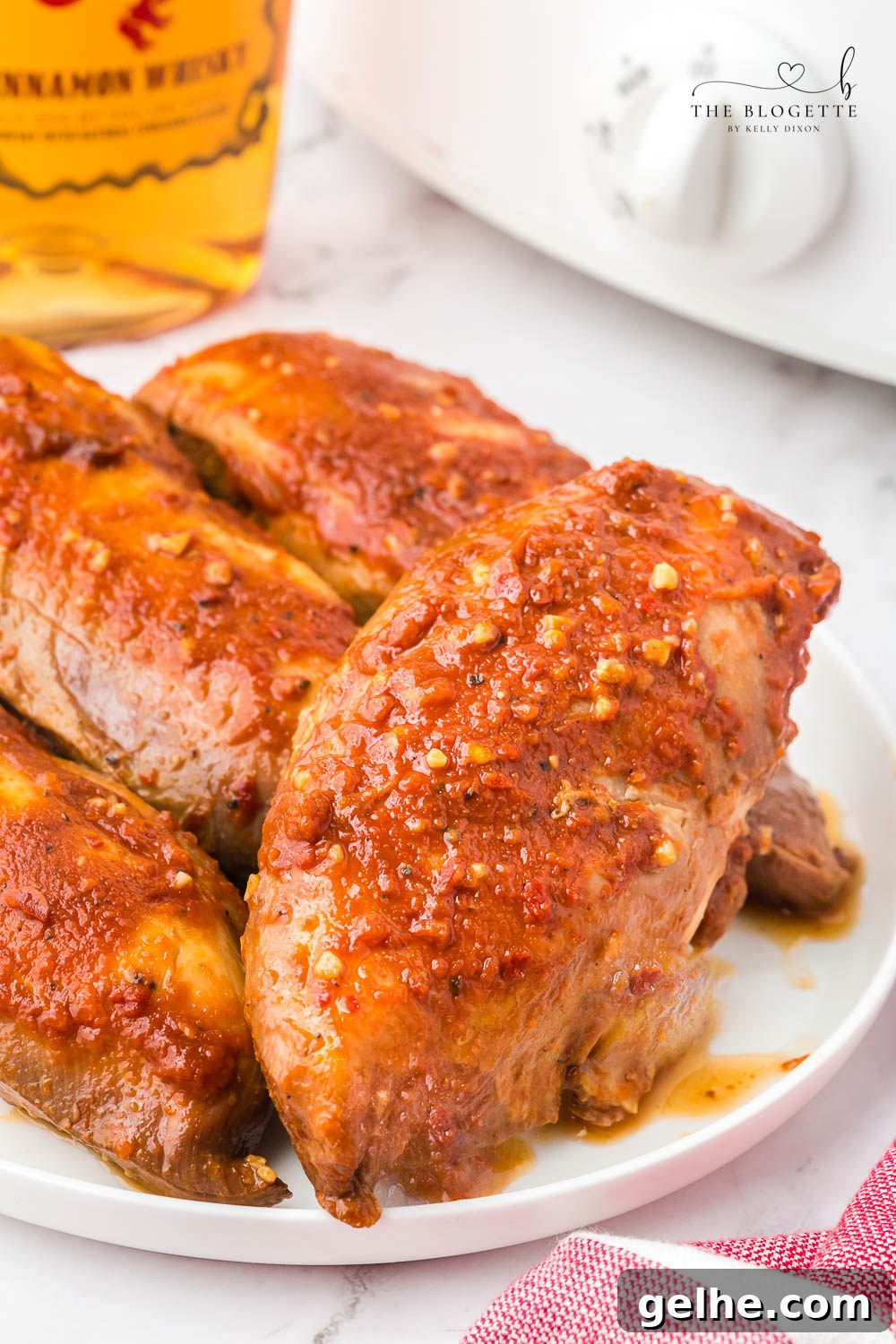 Crock Pot Fireball Chicken - a flavorful slow cooker chicken seasoned with a homemade Fireball-flavored sauce! The whiskey sauce makes the chicken so juicy and delicious.