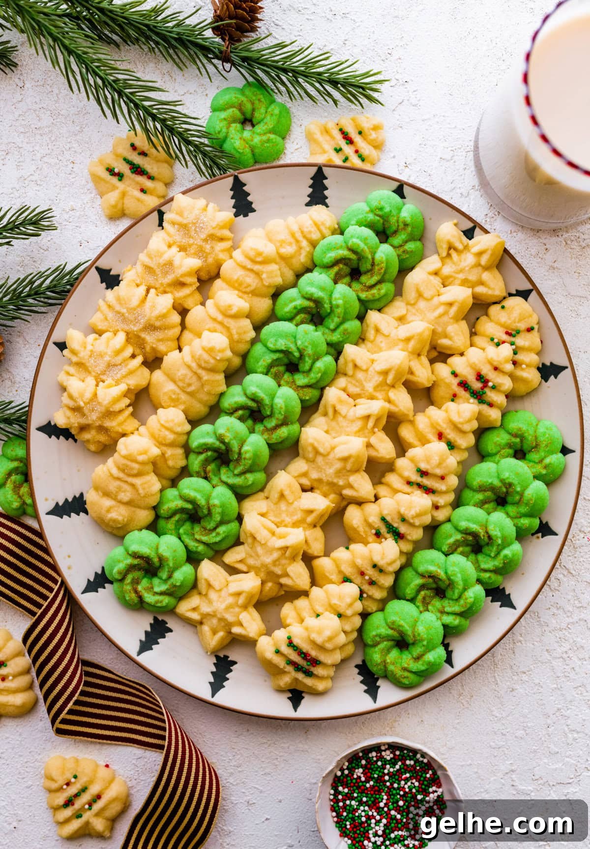 All the decorated spritz cookies on a beautiful festive cookie platter ready to serve.