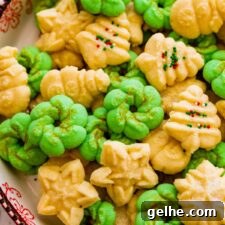 All the decorated spritz cookies on a beautiful festive cookie platter ready to serve.