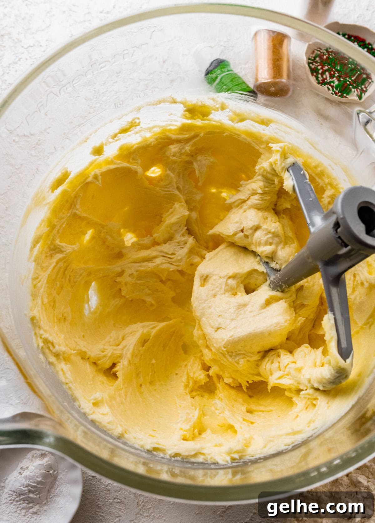 How to make Spritz cookies step-by-step: cream the butter and sugar.