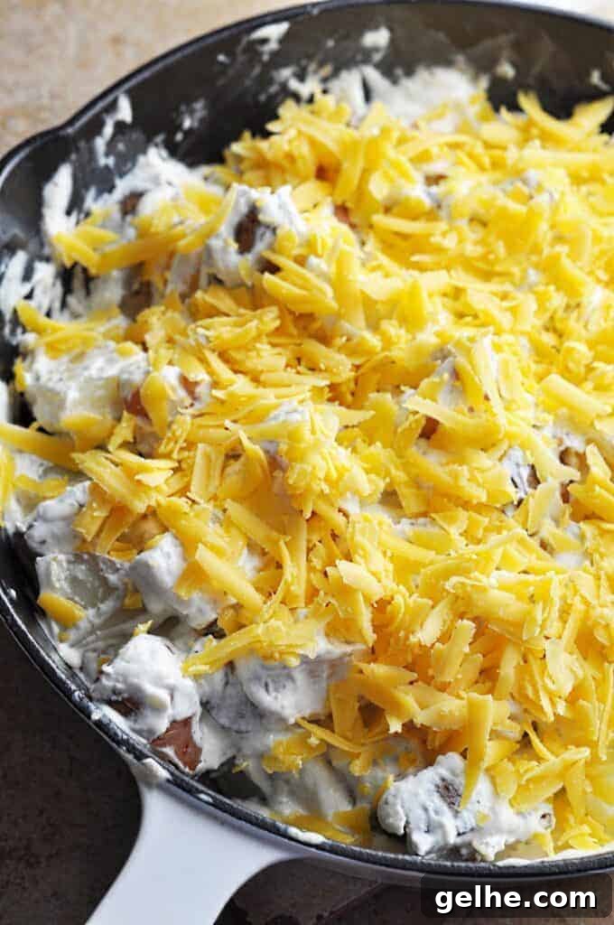 Cheesy Ranch Bacon Roasted Potatoes for Weeknight Dinners 4 Potatoes covered in sour cream and cheese