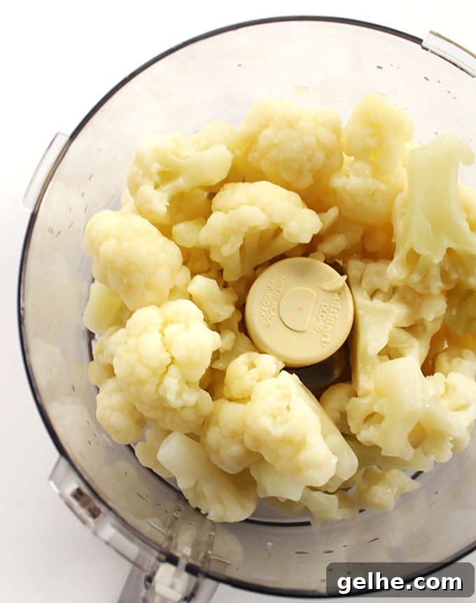 Easy Cauliflower Pizza Crust - Frozen cauliflower florets | robstrecipes.com