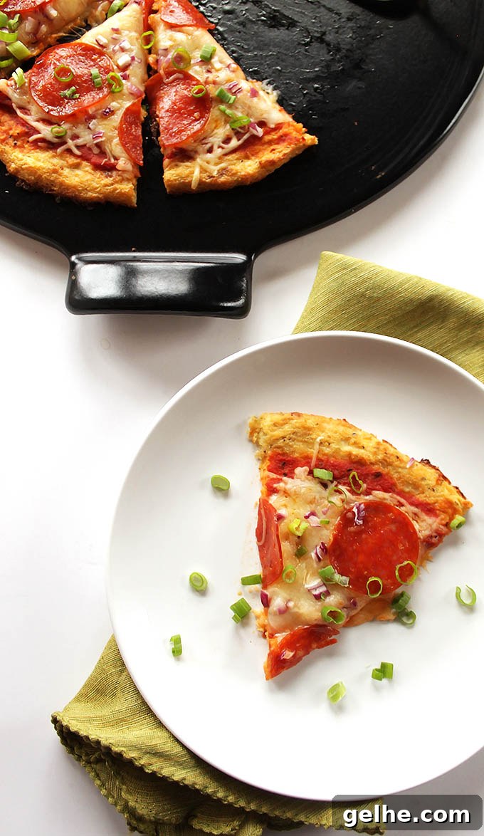 Easy cauliflower Pizza Crust - We use frozen cauliflower florets, which makes this crust a lot easier to make. It tastes delicious, is HEALTHY, and won't fall apart! You can top it with anything you prefer! Gluten Free | robustrecipes.com