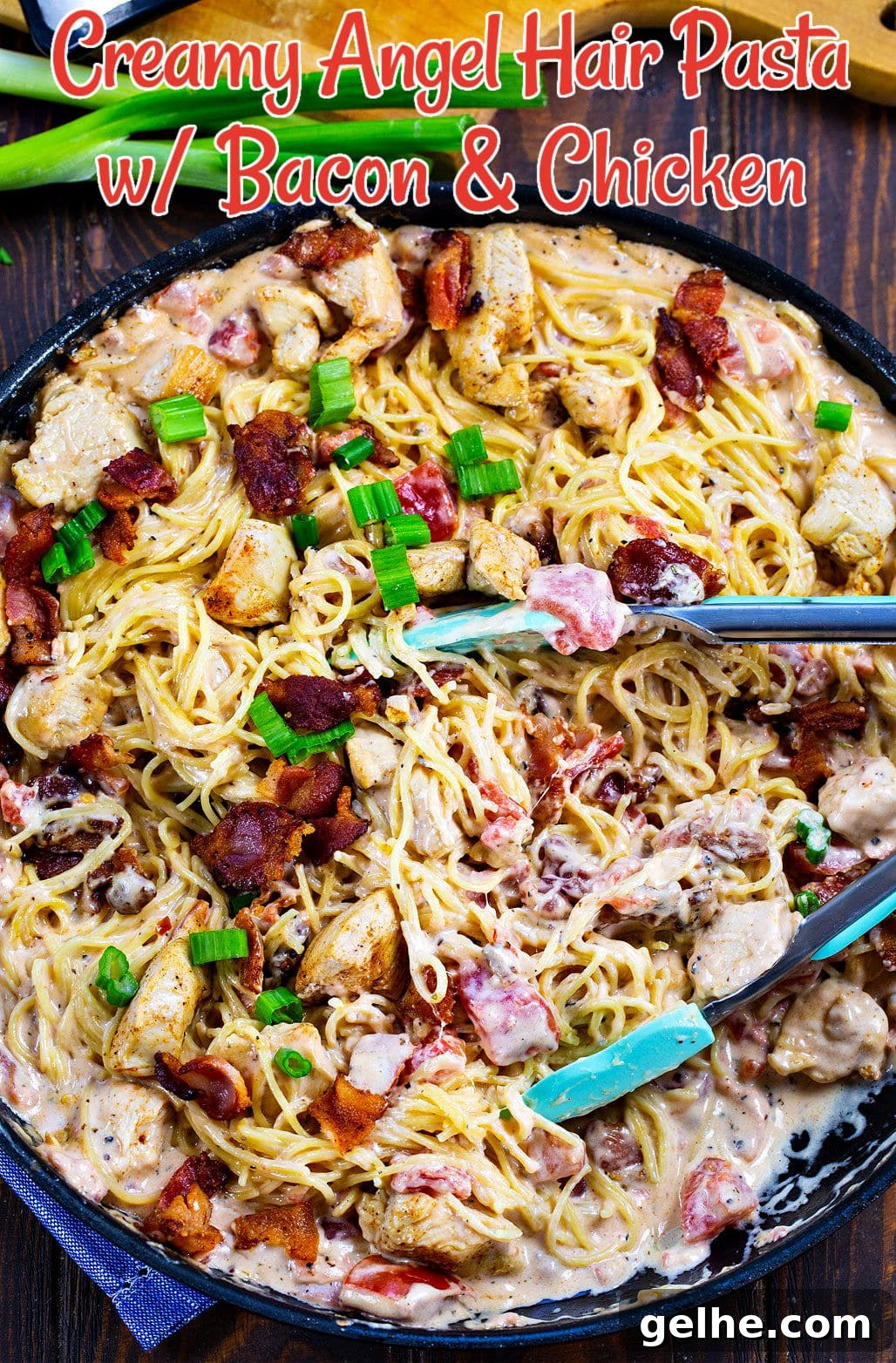 Creamy Angel Hair Pasta with Bacon and Chicken in large skillet with tongs.