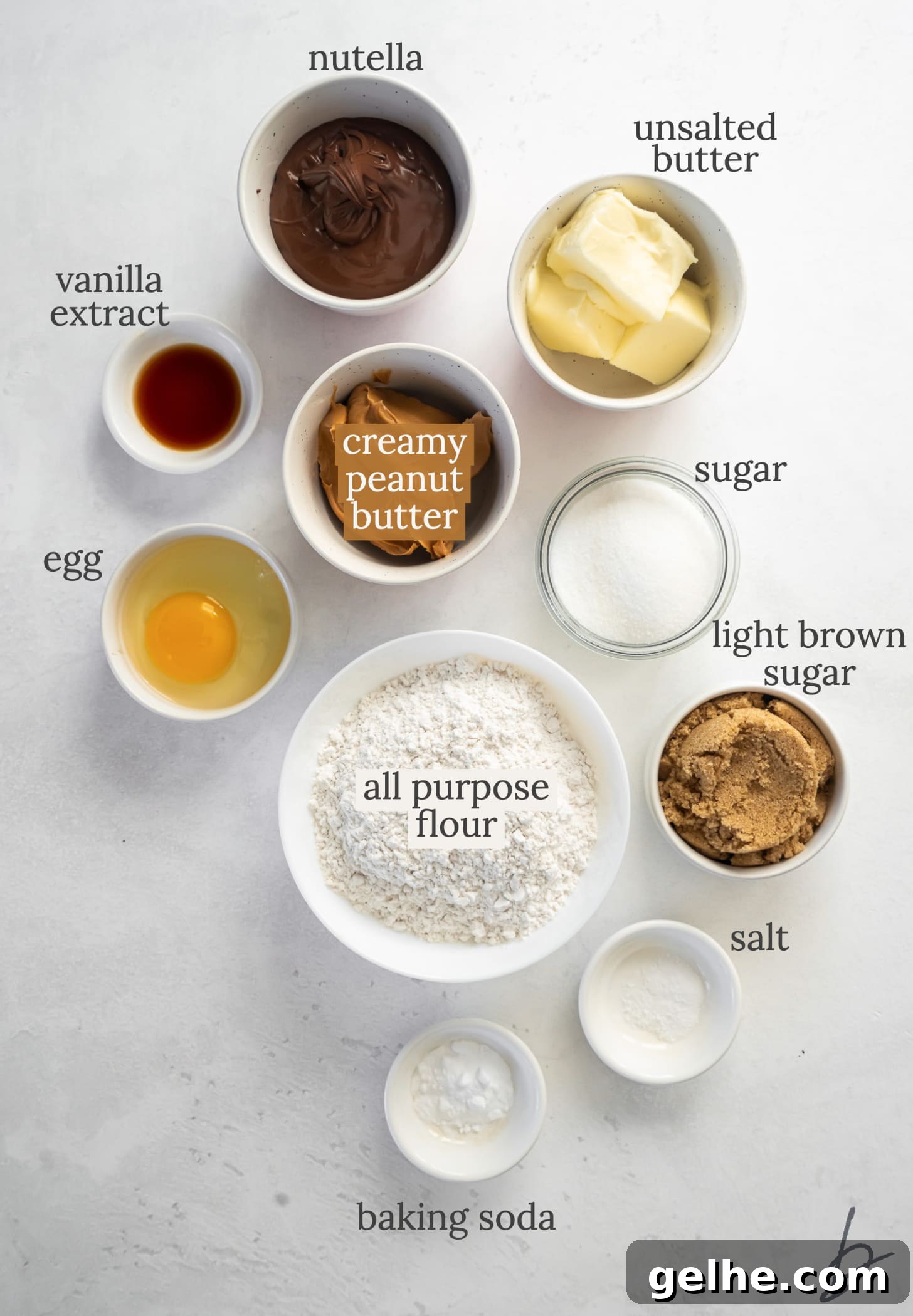 peanut butter nutella cookies ingredients in bowls with text.