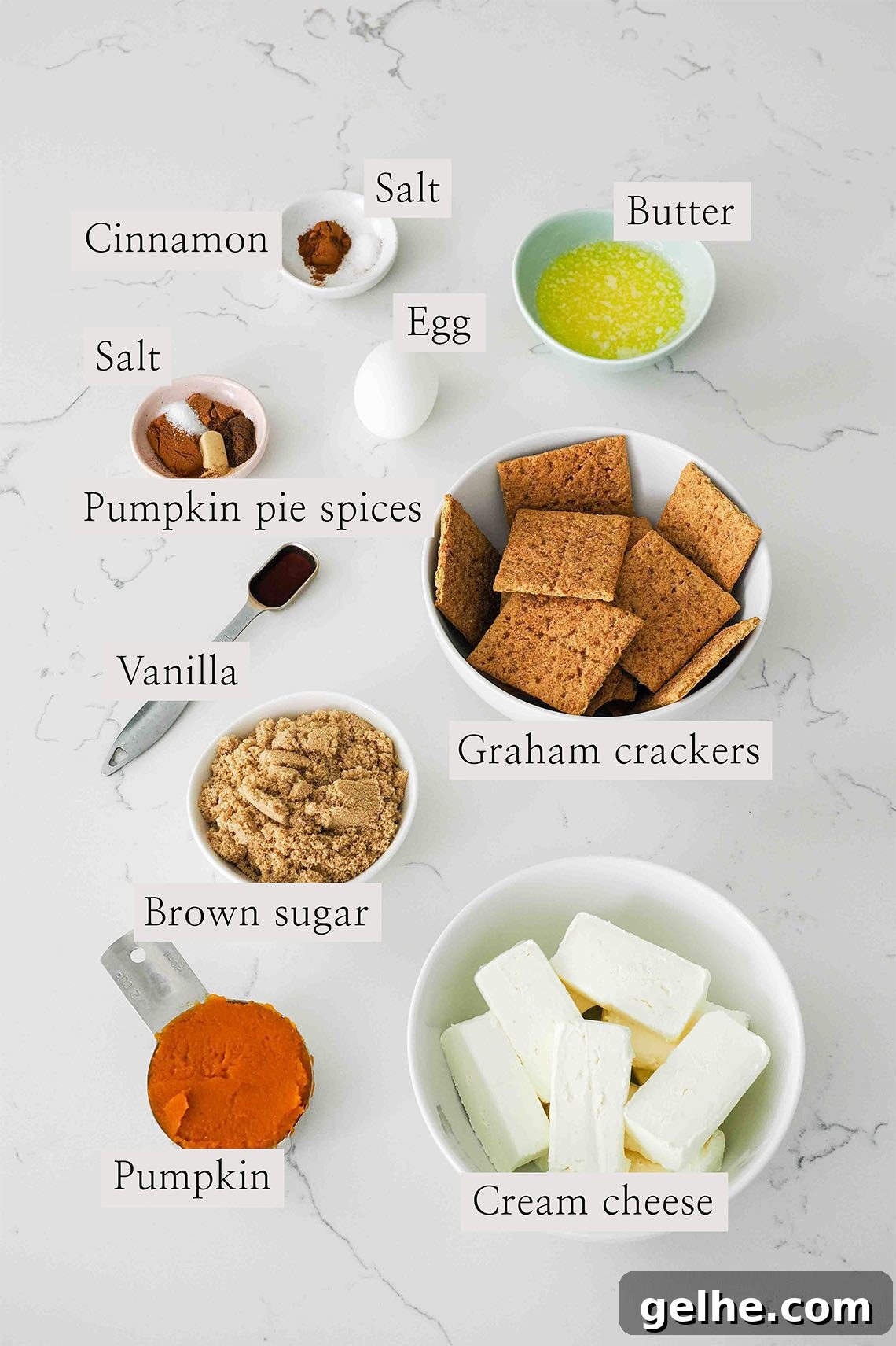 Mini Pumpkin Cheesecake Bites: Creamy Fall Dessert Recipe 3 Ingredients used to make mini pumpkin cheesecakes on a quartz counter.