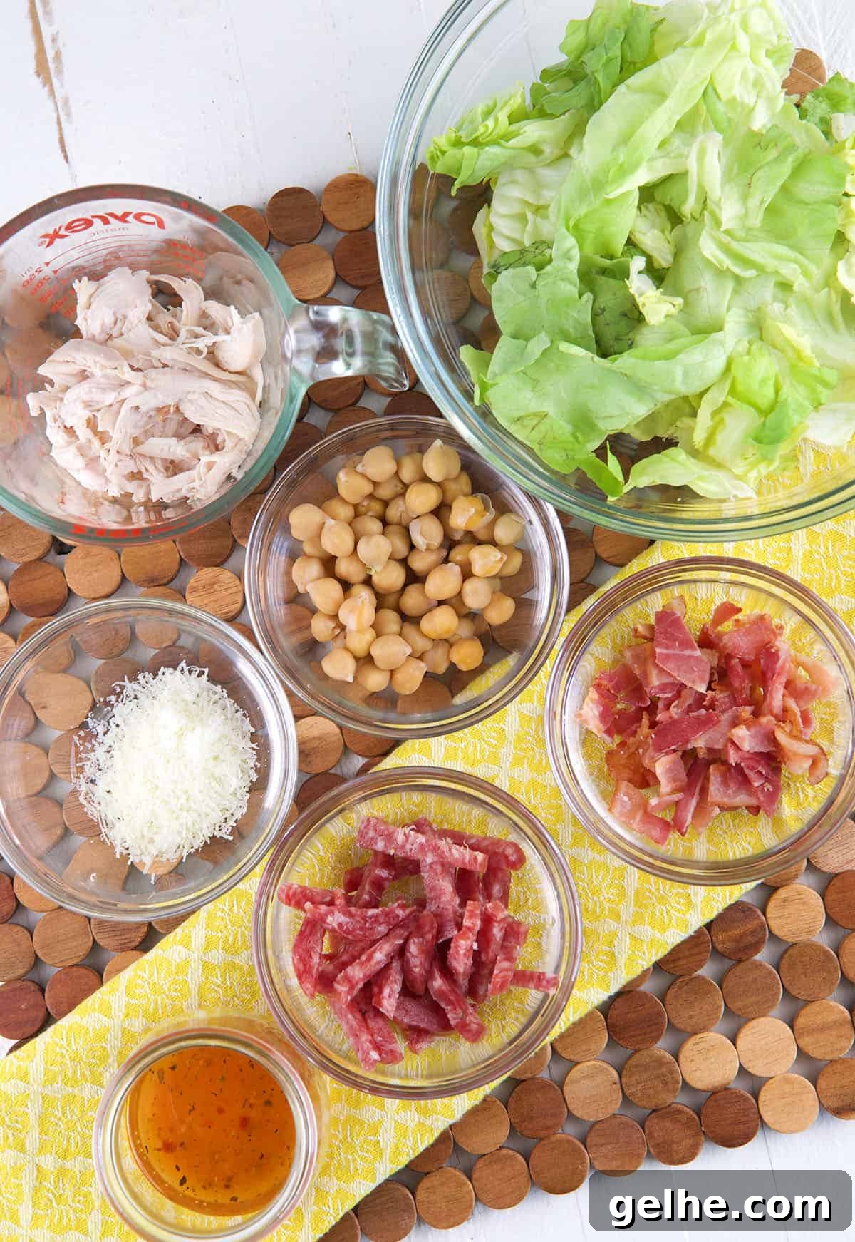 The ingredients for a salad are placed on a surface. 