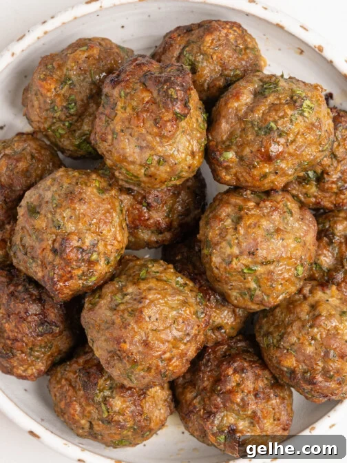 A bowl of baked lamb meatballs.