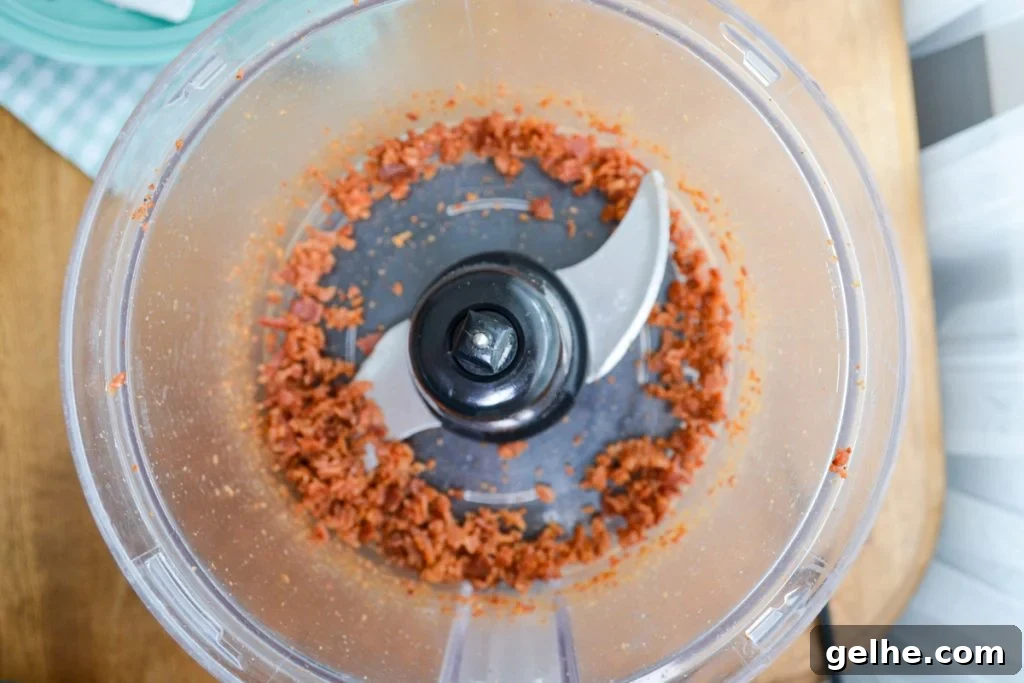 Bacon bits being processed in the food processor.