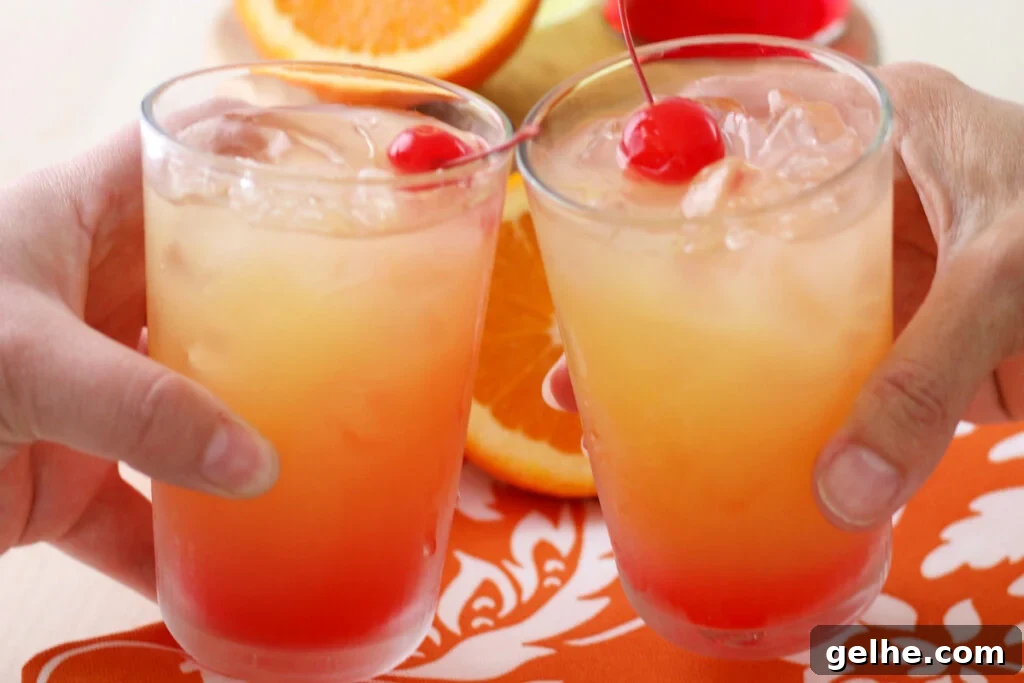 two glasses being clinked together