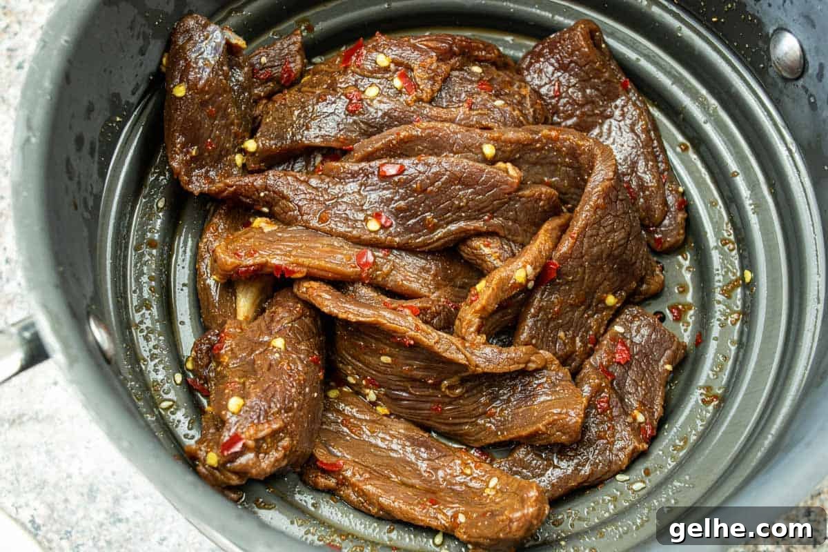 Venison jerky strained in colander