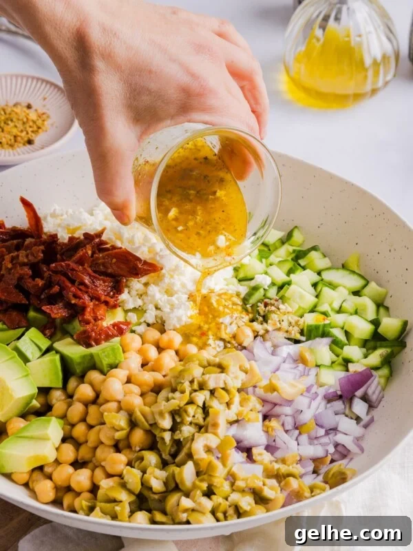 Chickpea Cucumber Feta Salad in a large, white serving bowl