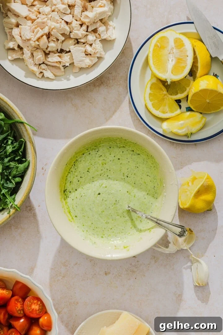 Creamy pesto dressing in a small bowl.