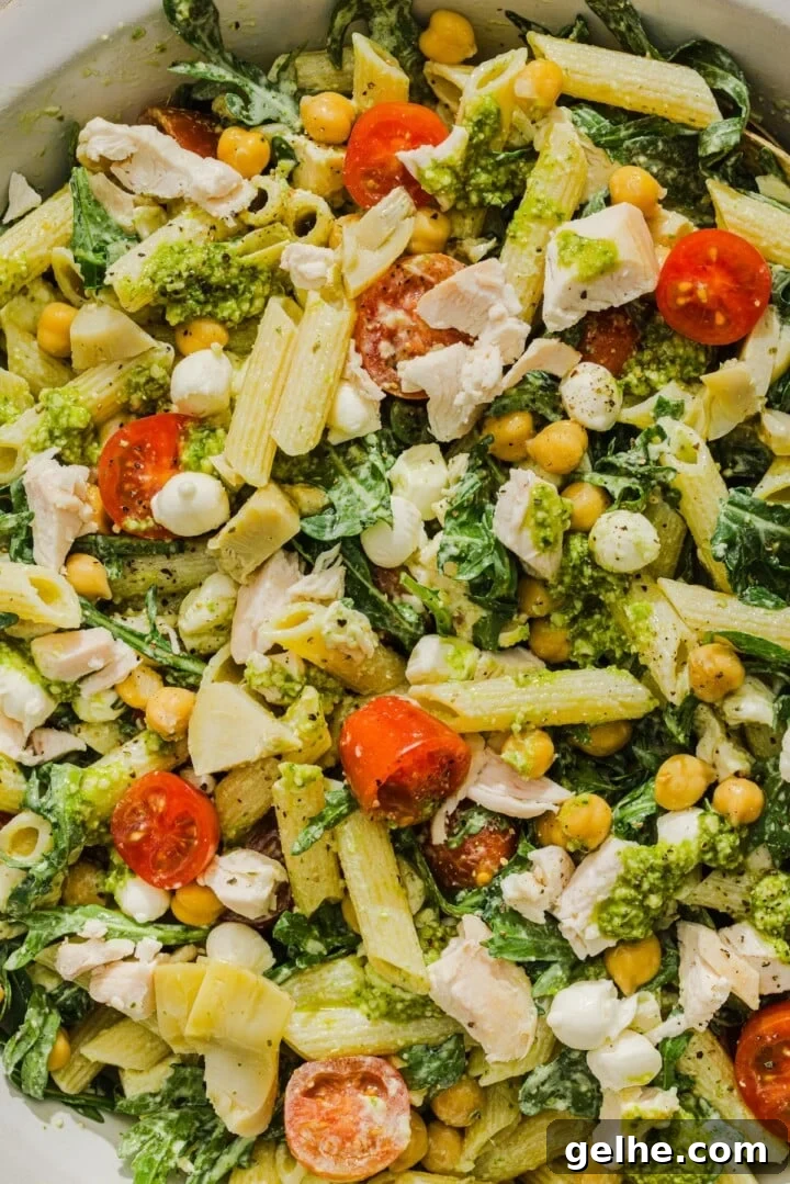 Close-up of pesto chicken pasta salad.