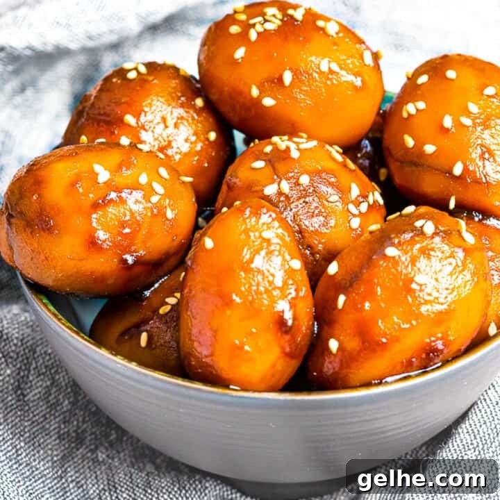 Korean Potato Side Dish, Gamja Jorim in a grey bowl on top of linen