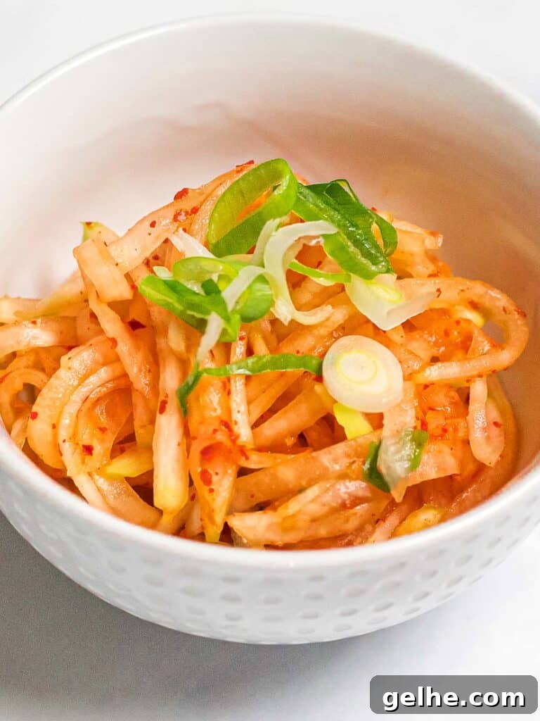 spicy Korean radish salad in a white bowl