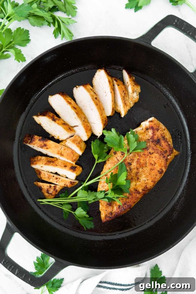 Perfectly Pan-Seared Chicken Breasts: Juicy, Crispy Results Every Time 8 Seared chicken in a skillet with parsley
