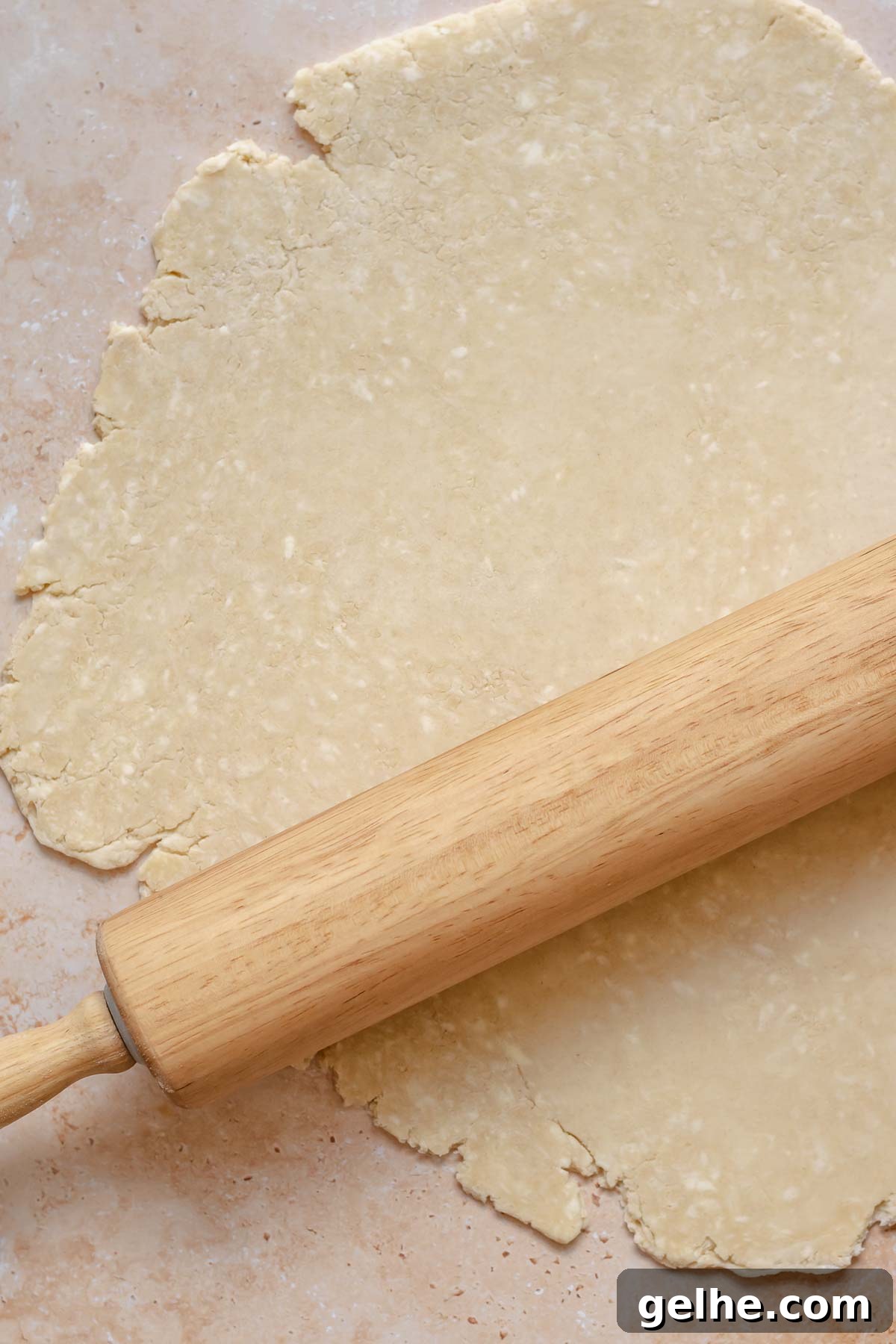 Cherry Rhubarb Pie Recipe: Sweet-Tart Homemade Dessert 7 A rolling pin rolls out pie crust.