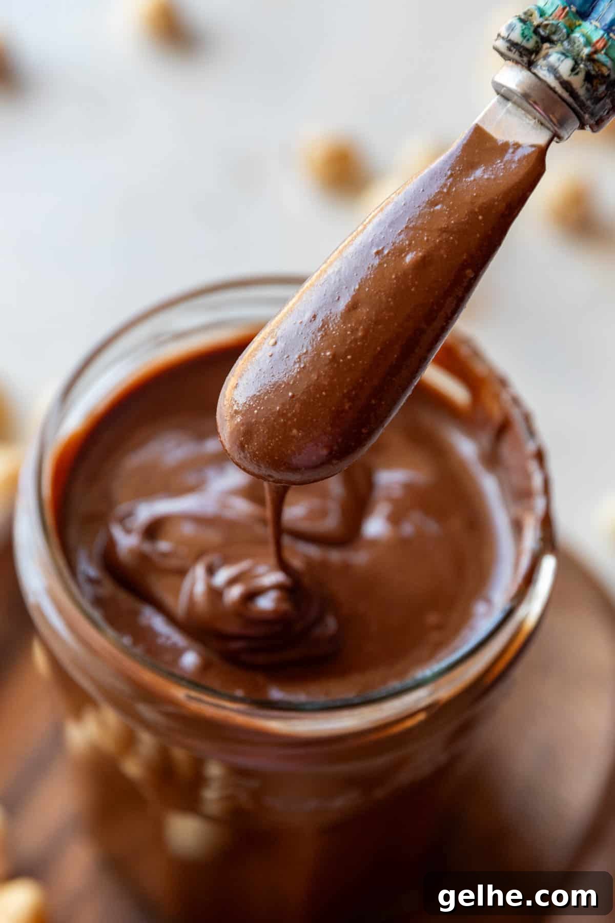Homemade Nutella chocolate spread in a jar with spoon