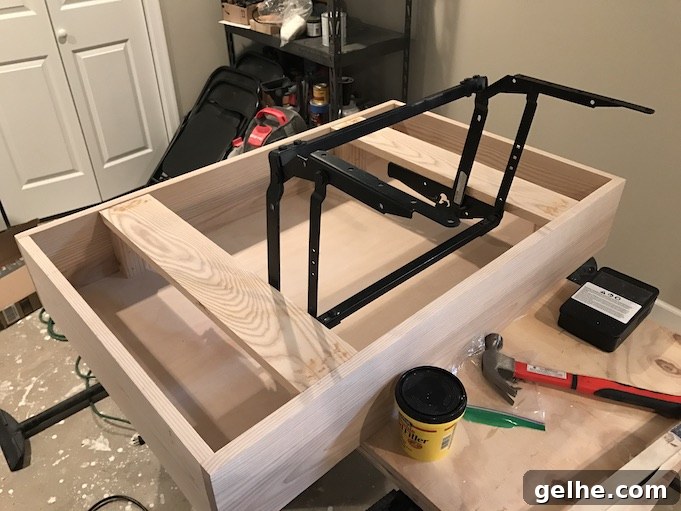 installing lift top mechanism to base of table