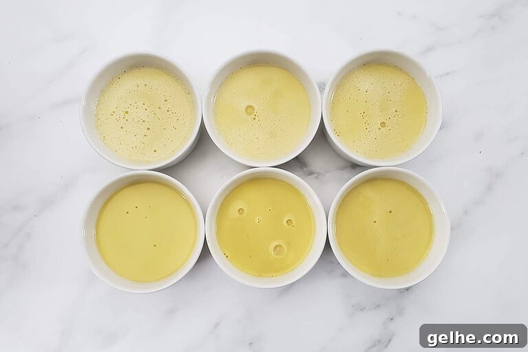 Crème Brûlée in the Instant Pot: Silky Custard with Caramelized Top 3 Creamy yellow custard in small white bowls.