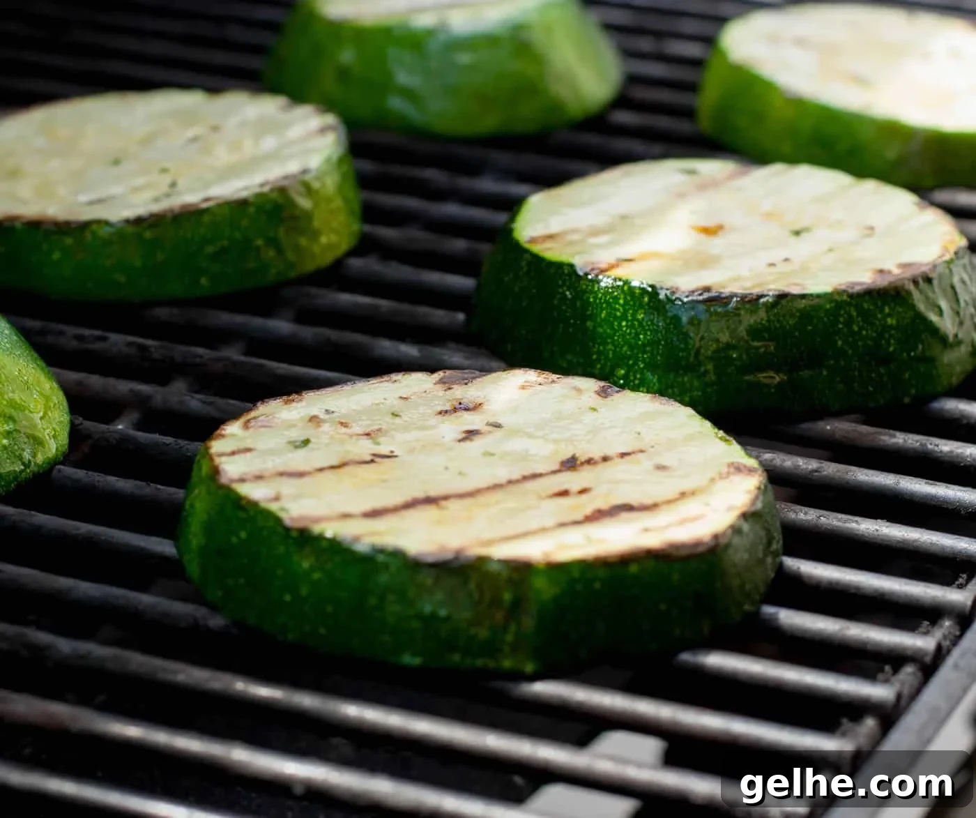Grilled Zucchini Caprese Stacks. Thick, meaty slices of zucchini are grilled then stacked with hearty slices of tomato and fresh mozzarella. Filling enough for a main, delicious as a side or pop it onto a bun for a delicious veggie sandwich!