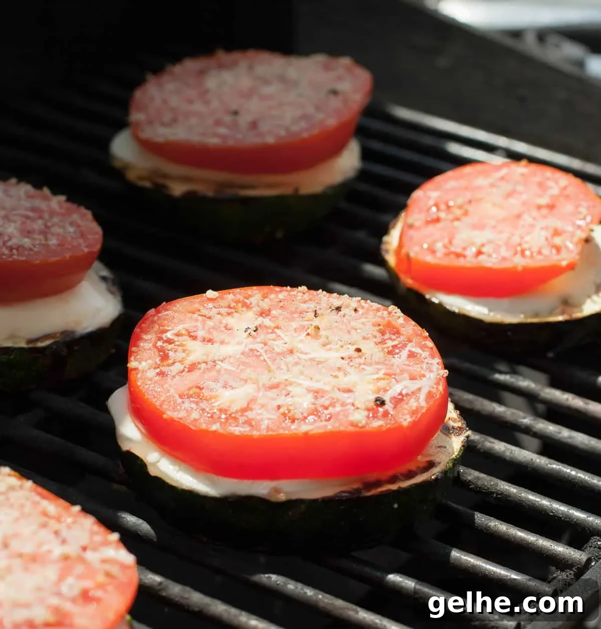 Grilled Zucchini Caprese Stacks. Thick, meaty slices of zucchini are grilled then stacked with hearty slices of tomato and fresh mozzarella. Filling enough for a main, delicious as a side or pop it onto a bun for a delicious veggie sandwich!