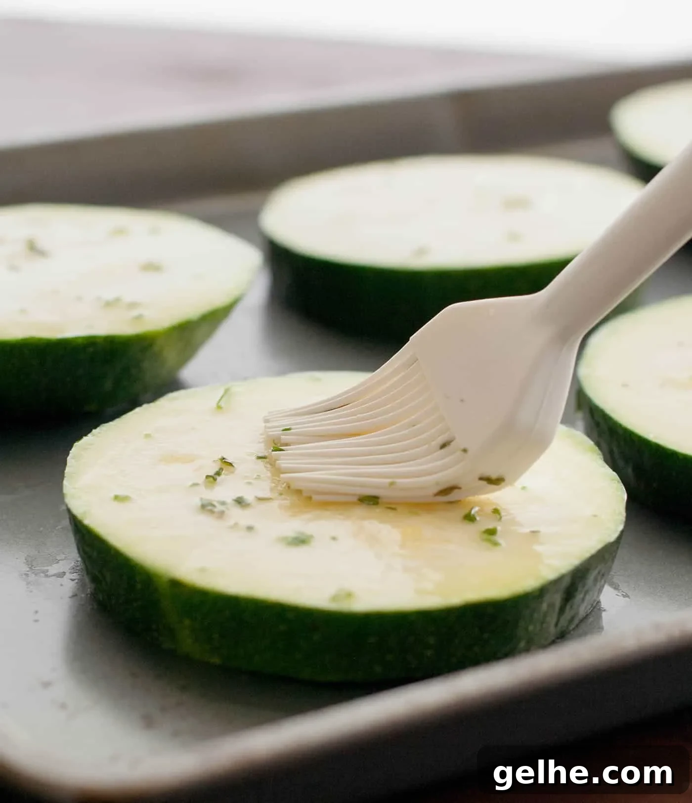 Grilled Zucchini Caprese Stacks. Thick, meaty slices of zucchini are grilled then stacked with hearty slices of tomato and fresh mozzarella. Filling enough for a main, delicious as a side or pop it onto a bun for a delicious veggie sandwich!
