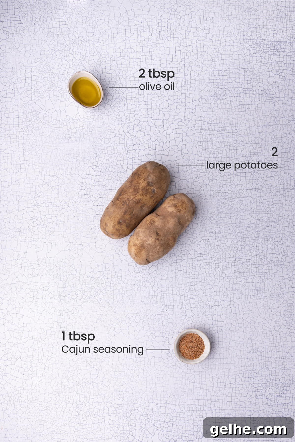 Crispy Cajun Fries: Oven or Air Fryer Recipe for Perfect Seasoning 3 All the ingredients for Cajun fries - olive oil, potatoes, and Cajun seasoning.