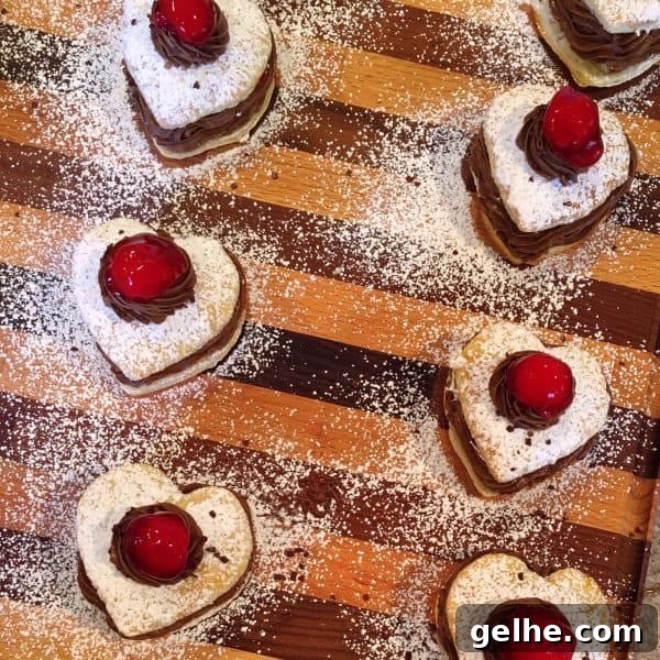 Chocolate Cherry Napoleons topped with chocolate whipped cream and a cherry