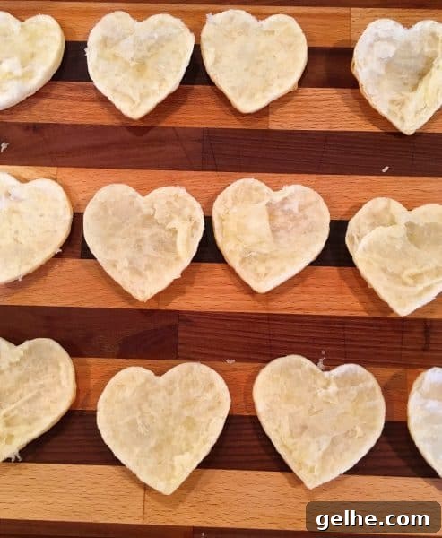 Baked Puff Pastry on a cutting board split in half