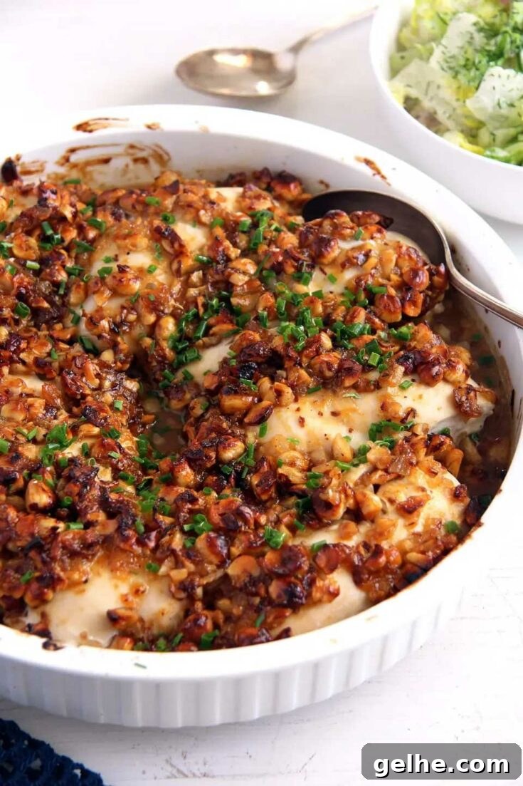 Finished glazed hazelnut chicken in white bowl.