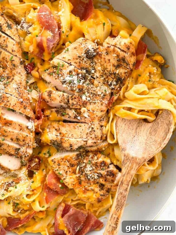 Butternut squash chicken and pasta on serving dish.