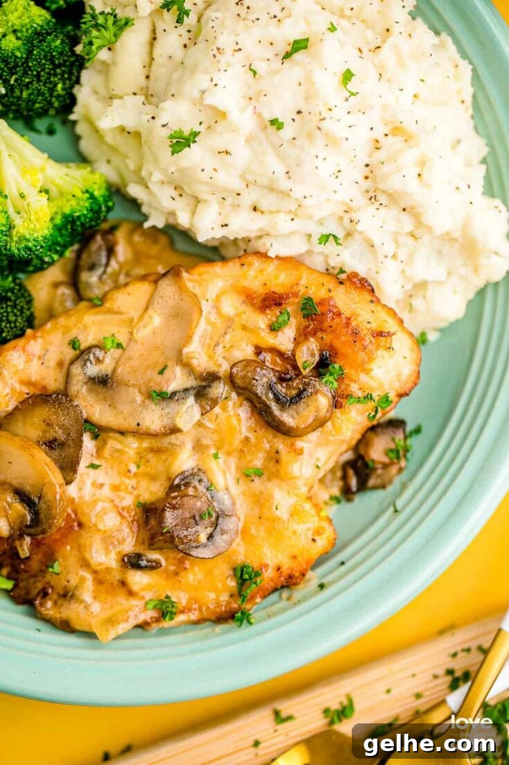 Chicken Marsala served on plate with sides.