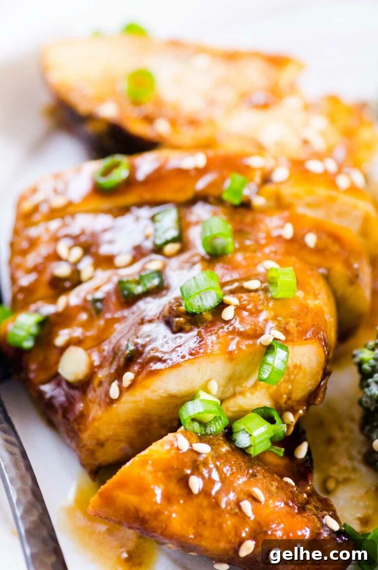 Honey garlic glazed chicken sliced and garnished.