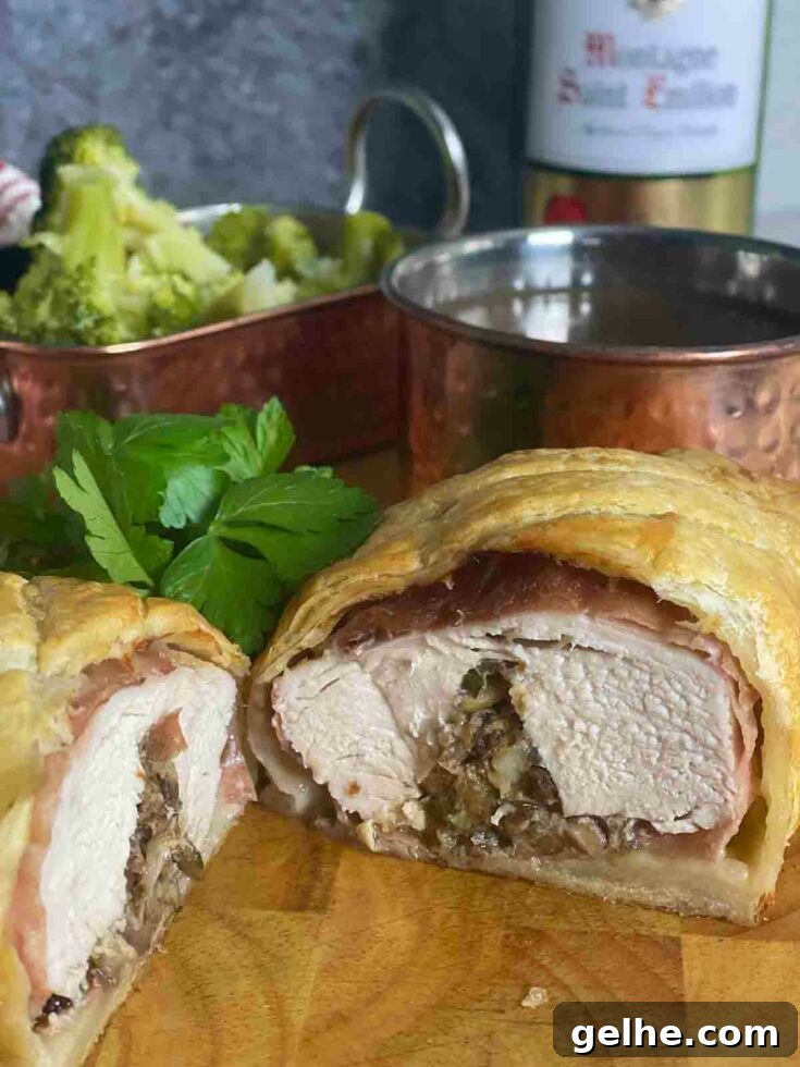 Chicken en croute sliced to show interior.