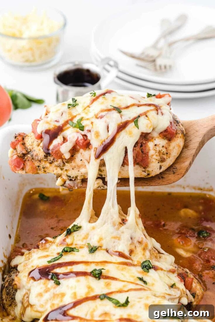 Bruschetta chicken bake with cheesy pull.
