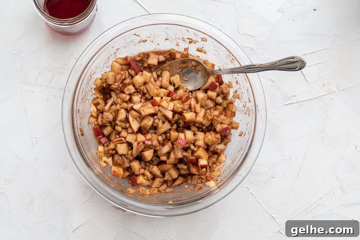 wine just poured over apple, cinnamon and nut mixture
