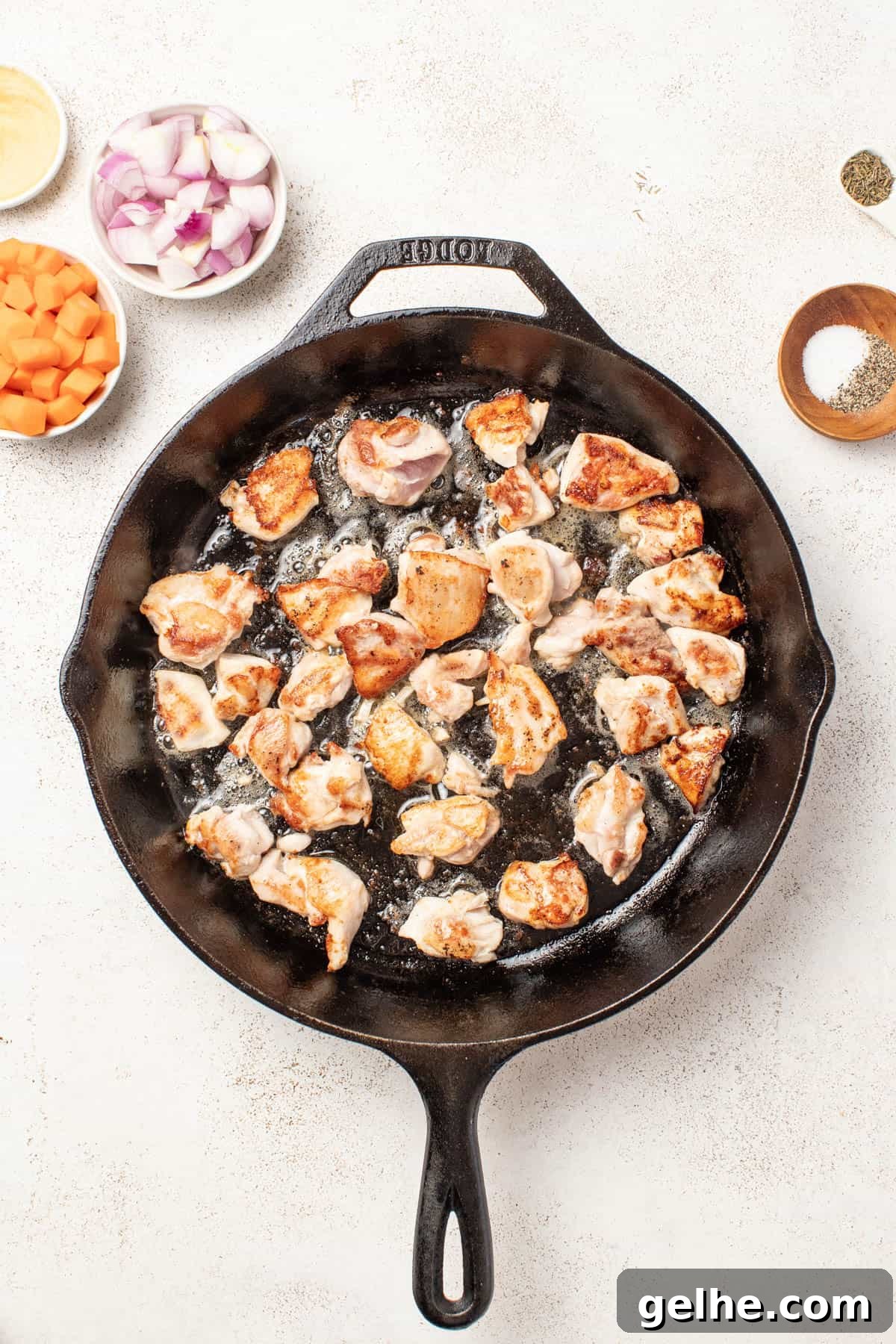Dijon Chicken Skillet with Wild Rice and Creamy Mustard Sauce 5 Browning chicken thighs in a cast iron pan.