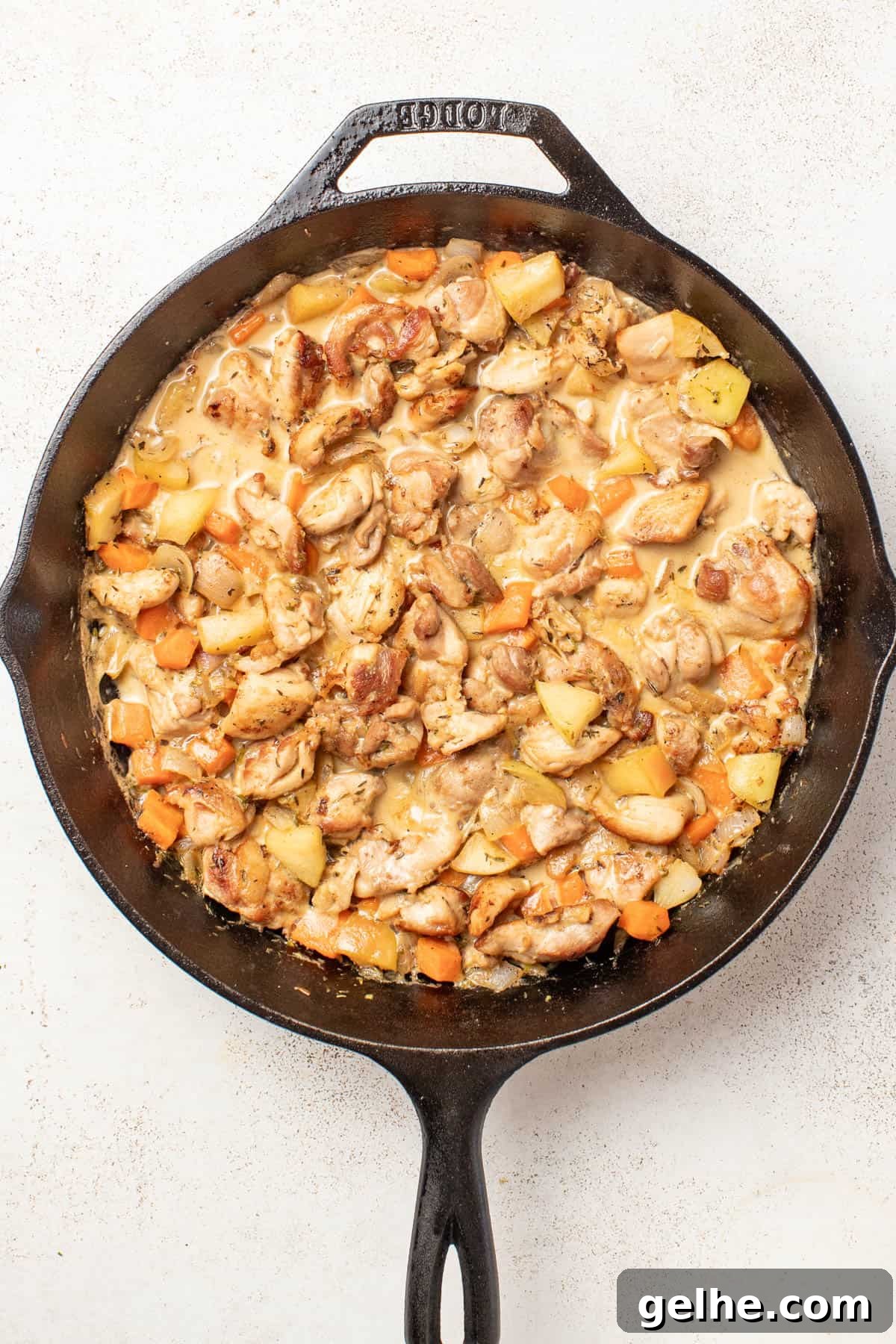 Dijon Chicken Skillet with Wild Rice and Creamy Mustard Sauce 7 Adding the cooked chicken back into the dijon sauce after being reduced.