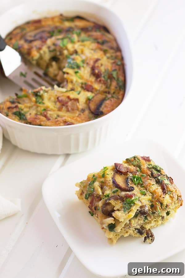 a square slice of bacon, mushroom, and spinach in a breakfast casserole