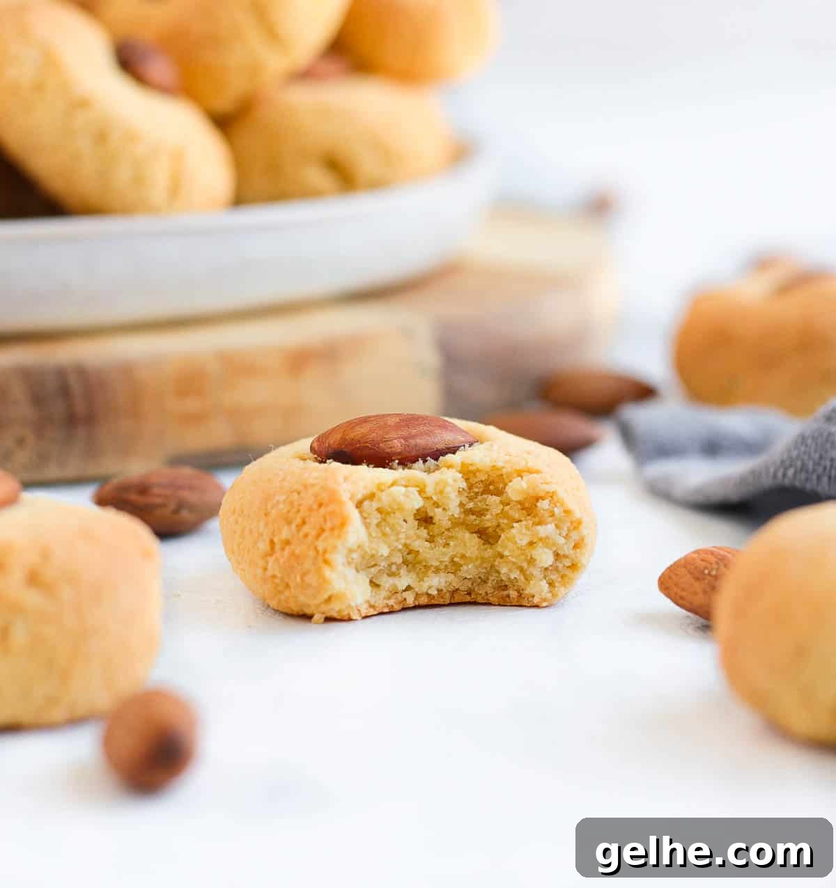 A cookie with one bite taken off.